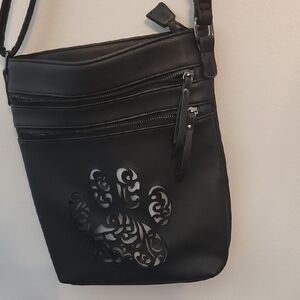 Elegant Black Crossbody Bag with Artistic Cutout